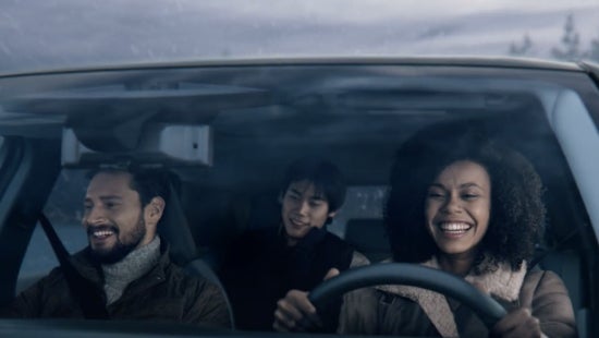 Three passengers riding in a vehicle and smiling | Passport Nissan in Marlow Heights MD